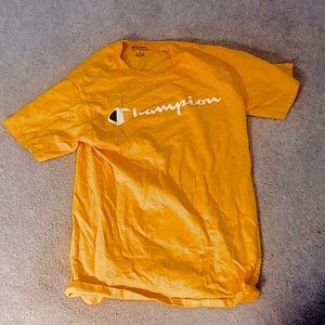 I am selling a yellow champion T- Shirt for $14